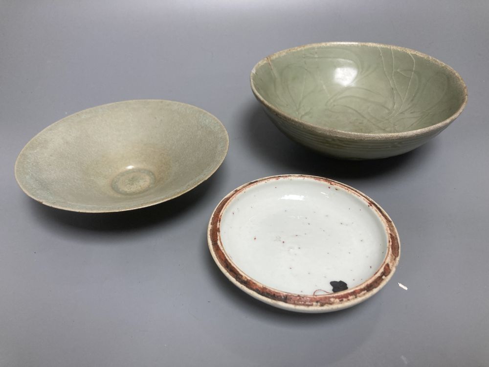 A Chinese Longquan celadon bowl, Song dynasty, 16cm, a conical celadon dish and a seal paste box base